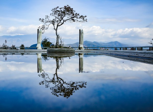 What are the best methods for controlling water temperature fluctuations in UK indoor pools?